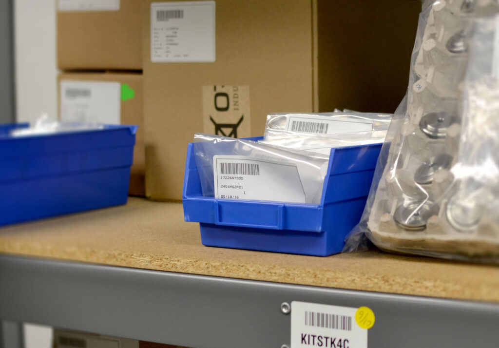 Orkal, Orkal Industries' branded blue bins hold aerospace grade fluid fittings for repairs or assembly within logistic supports settings.